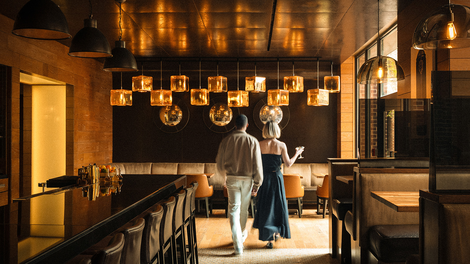 The warmly lit dining room at Bourbon Steak in Washington, DC